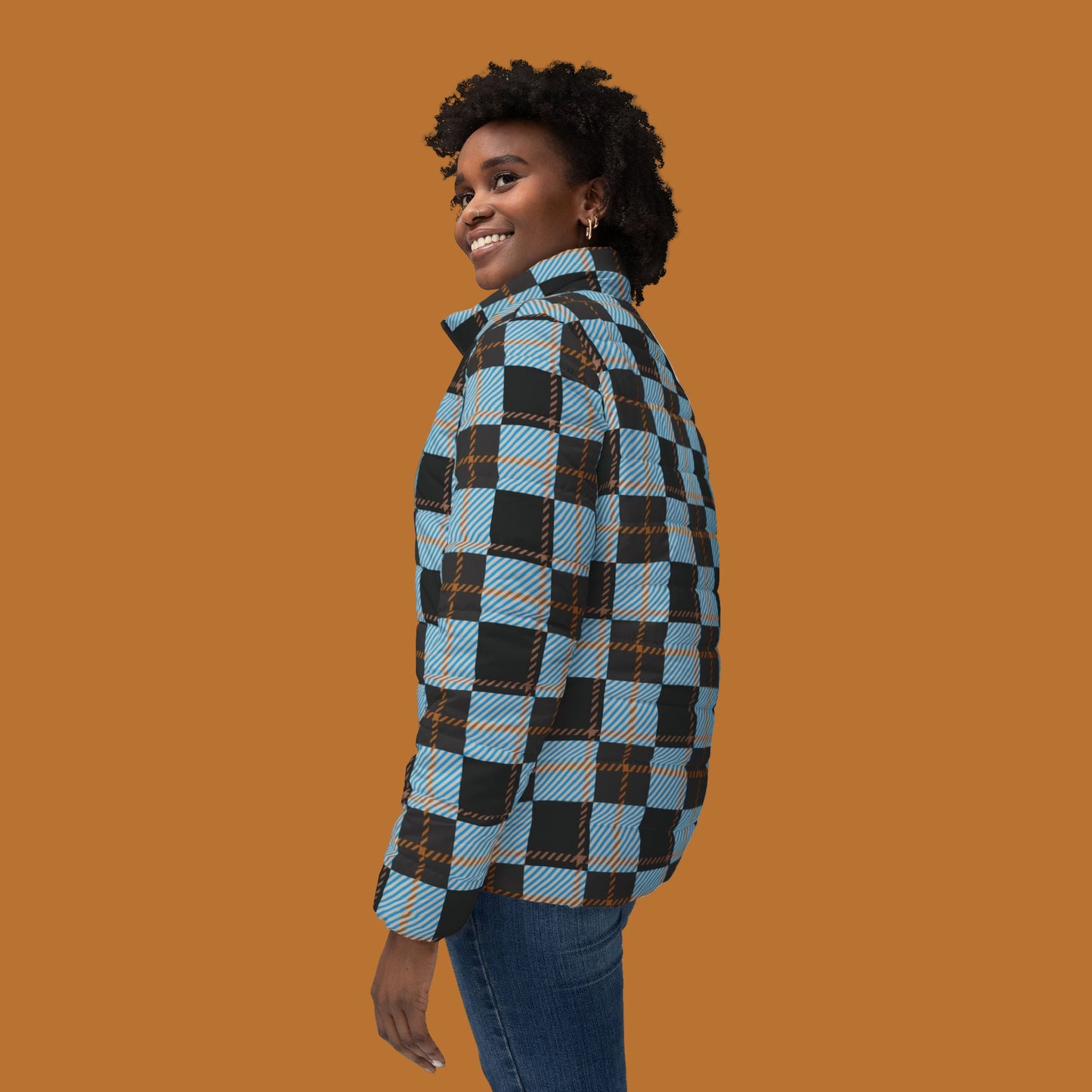 Person wearing a blue and black plaid shirt on a white background