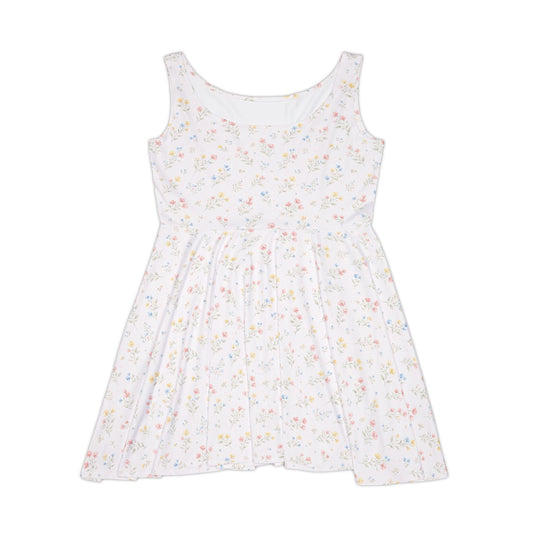 White sleeveless dress with small colorful floral pattern on a white background