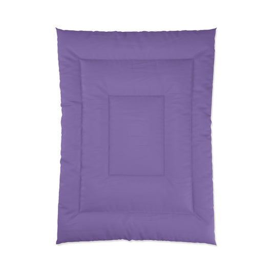 Purple comforter on a white background