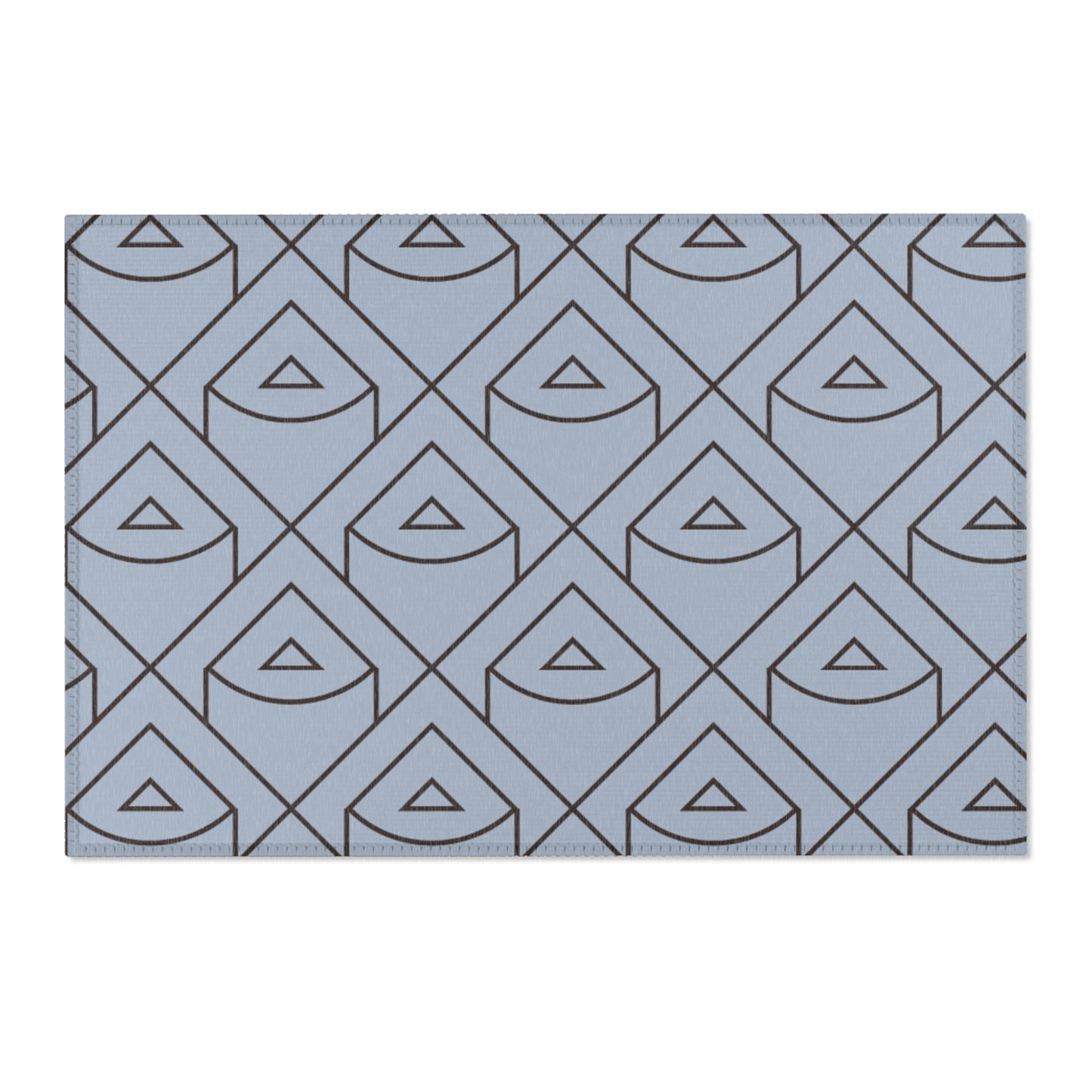 Blue rug with geometric triangle pattern on a white background