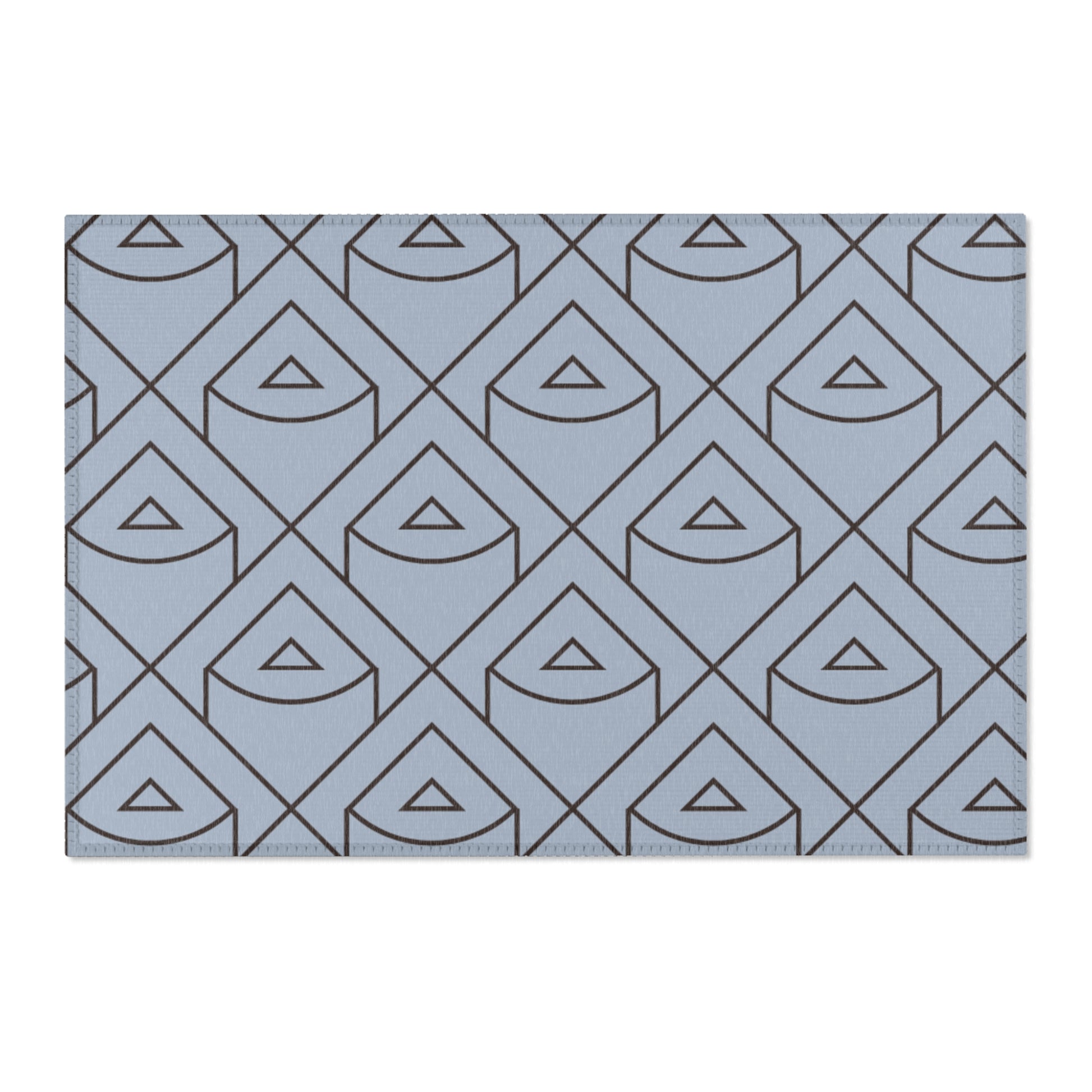 Blue rug with geometric triangle pattern on a white background