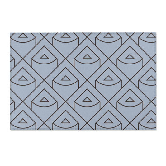 Blue rug with geometric triangle pattern on a white background