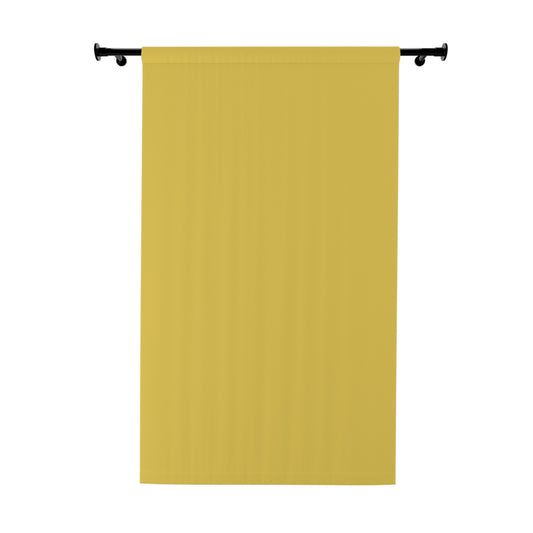Mustard yellow curtain panel on a black rod against a white background