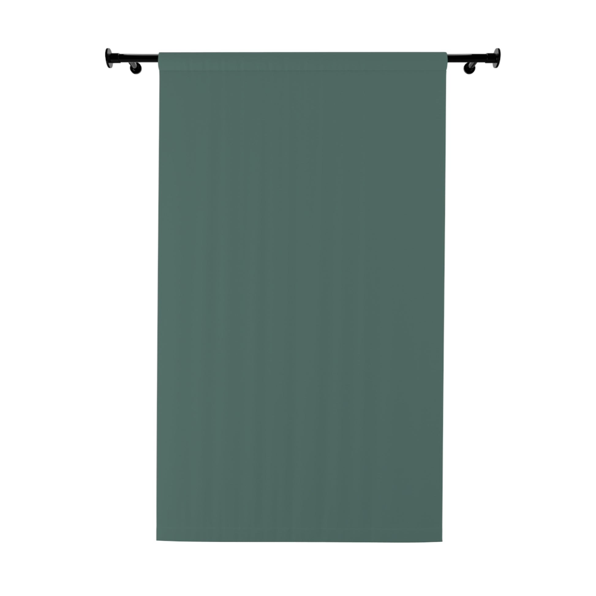 Green curtain hanging on a rod against a white background