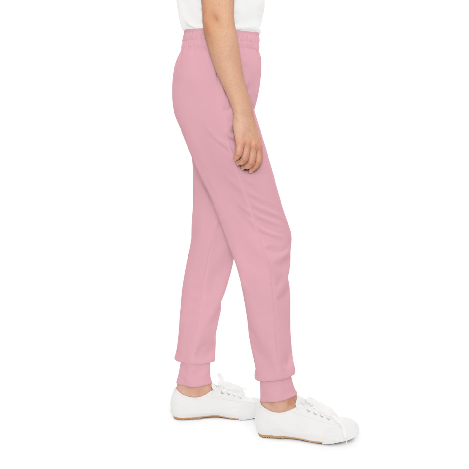 Pink sweatpants worn by a person on a white background