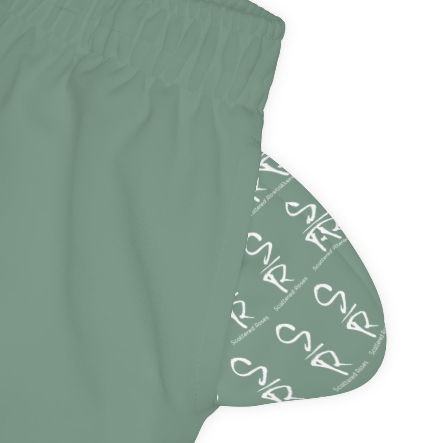 Green sleeveless top with brand logo on a white background