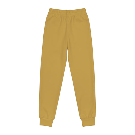 Mustard yellow sweatpants on a white background