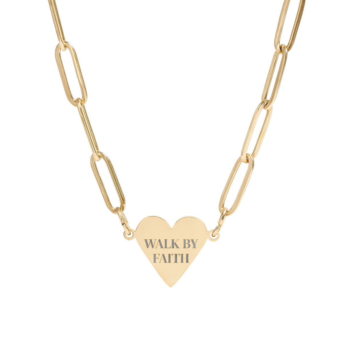 Gold heart-shaped pendant necklace with 'I'm here and I'm healed' engraving on a white background