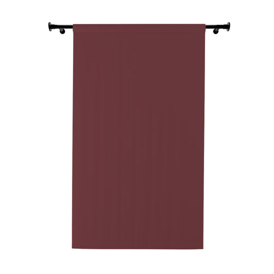 Dark gray curtain hanging on a rod against a white background